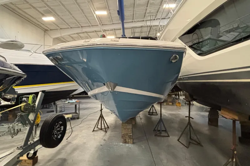 Slide: The Image of 2018 Regal 23 OBX boat cockpit with steering wheel and control panel. - 3