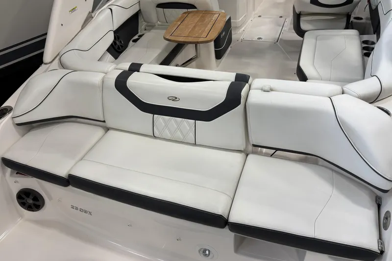Slide: The Image of 2018 Regal 23 OBX boat with Yamaha 250 outboard motor in a storage facility. - 8