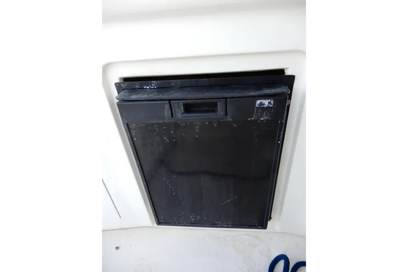 Slide: The Image of Black refrigerator on a 2004 Sea Ray 300 Sundancer boat. - 15