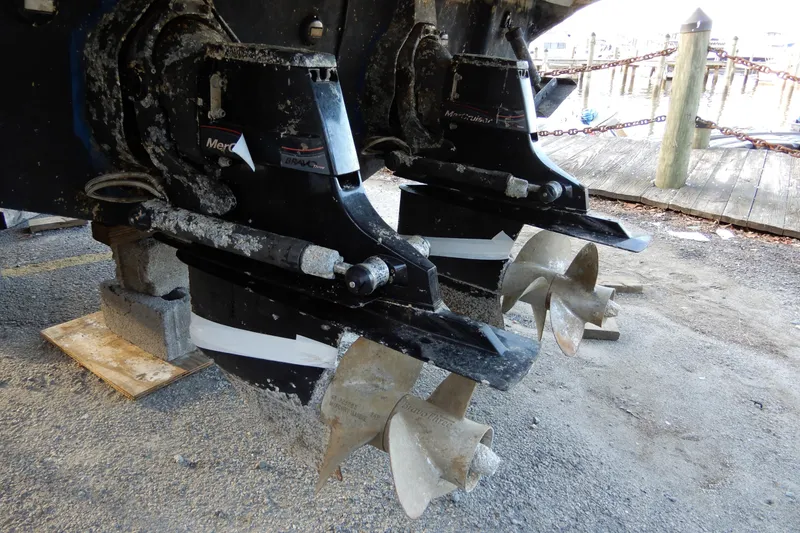 Slide: The Image of 2004 Sea Ray 300 Sundancer boat propellers with visible marine growth. - 16