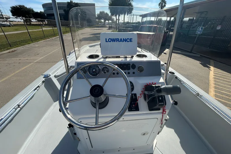 Slide: The Image of 2017 Blue Wave 1900 STL boat console with steering wheel and Lowrance navigation system. - 12