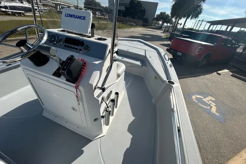 Slide: The Image of 2017 Blue Wave 1900 STL boat with Lowrance equipment, parked near a red truck. - 14