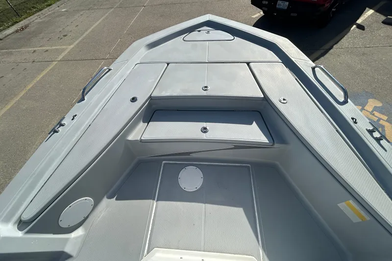 Slide: The Image of 2017 Blue Wave 1900 STL boat deck, featuring storage compartments and sleek design. - 15