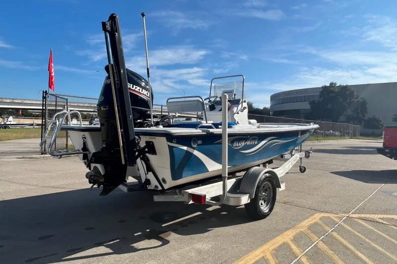 Slide: The Image of 2017 Blue Wave 1900 STL boat on trailer with Suzuki outboard motor. - 5
