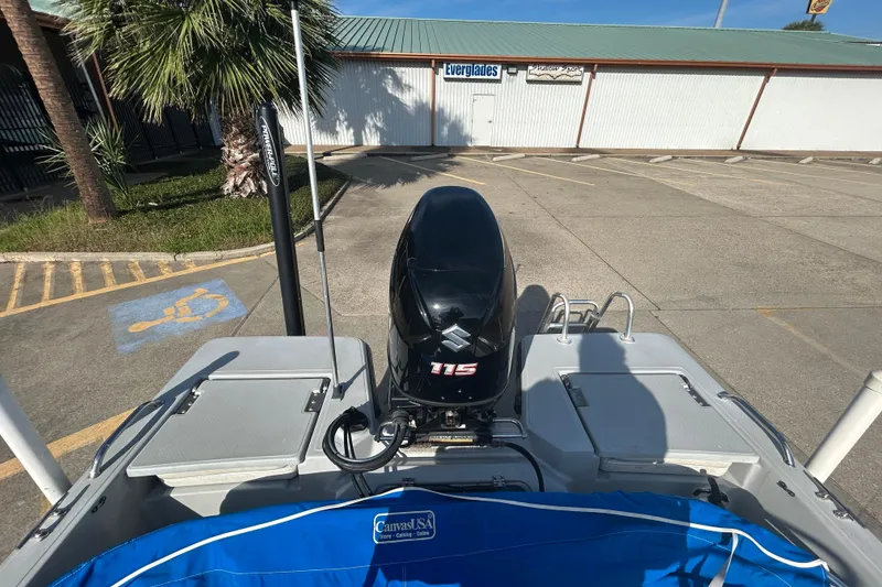 Slide: The Image of 2017 Blue Wave 1900 STL boat with Suzuki 115 engine in parking lot. - 8