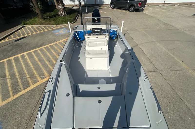 Slide: The Image of 2017 Blue Wave 1900 STL boat, top view, parked in a lot with accessible parking. - 9