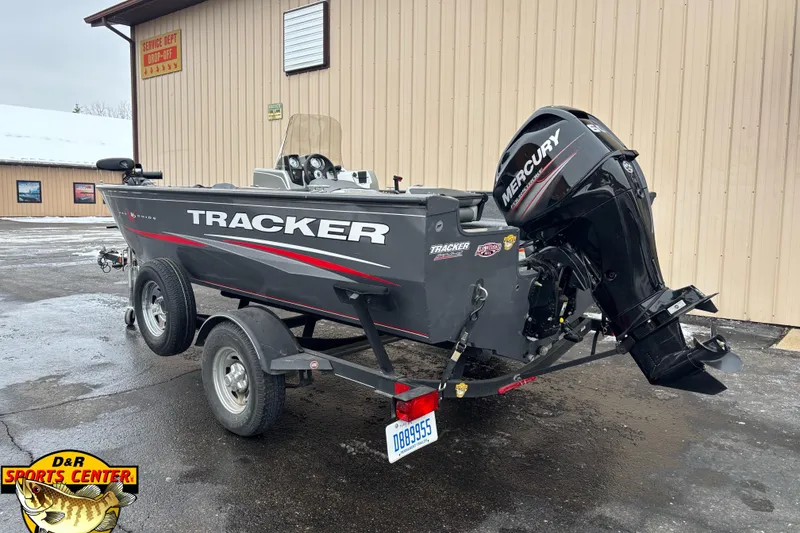 Slide: The Image of 2018 Tracker Pro Guide V-16 SC boat with Mercury engine on trailer. - 2