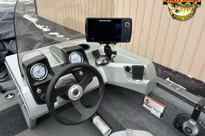 Slide: The Image of 2018 Tracker Pro Guide V-16 SC boat dashboard with steering wheel and Humminbird fish finder. - 4