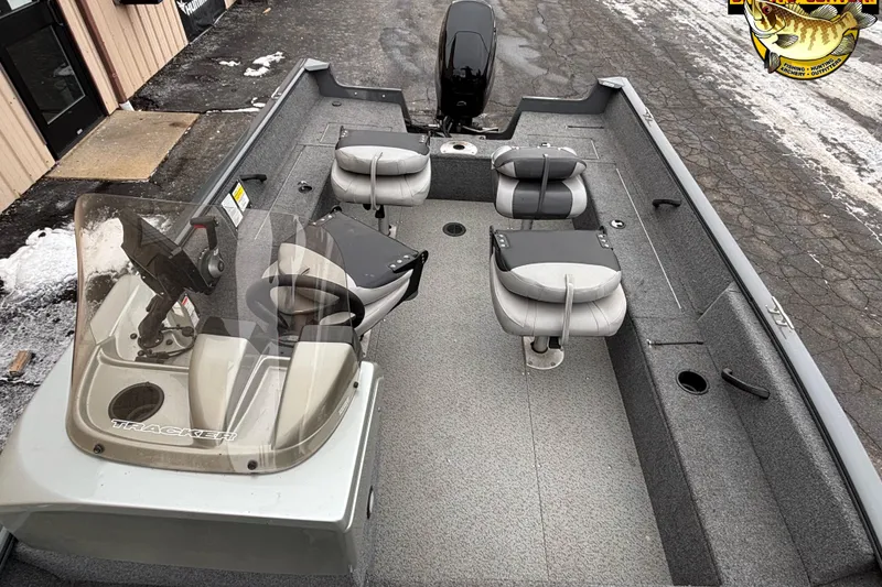 Slide: The Image of 2018 Tracker Pro Guide V-16 SC fishing boat with seating and steering console. - 5