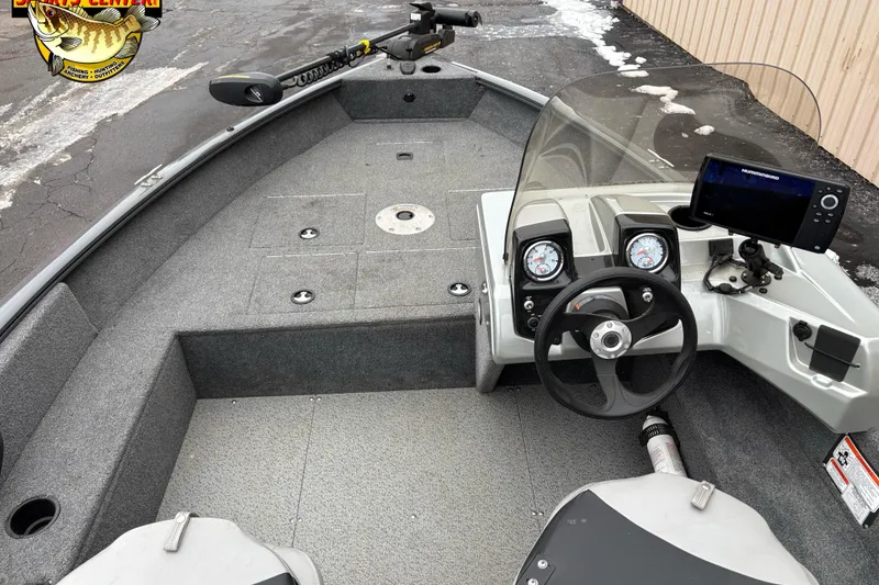 Slide: The Image of 2018 Tracker Pro Guide V-16 SC boat interior with steering wheel and navigation equipment. - 6