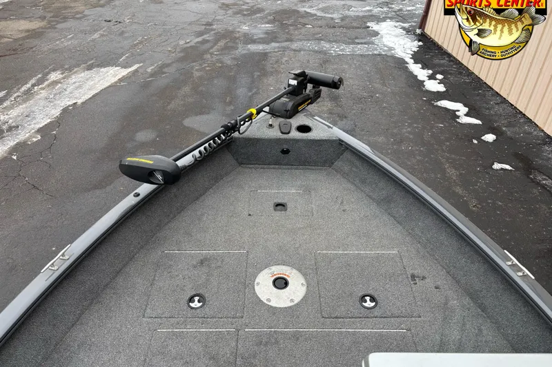 Slide: The Image of 2018 Tracker Pro Guide V-16 SC boat deck with trolling motor, parked on asphalt. - 7