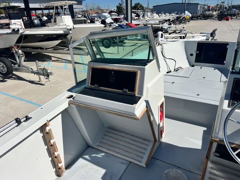 Slide: The Image of Interior view of a 1986 Wellcraft V-20 Sport boat at the marina. - 15