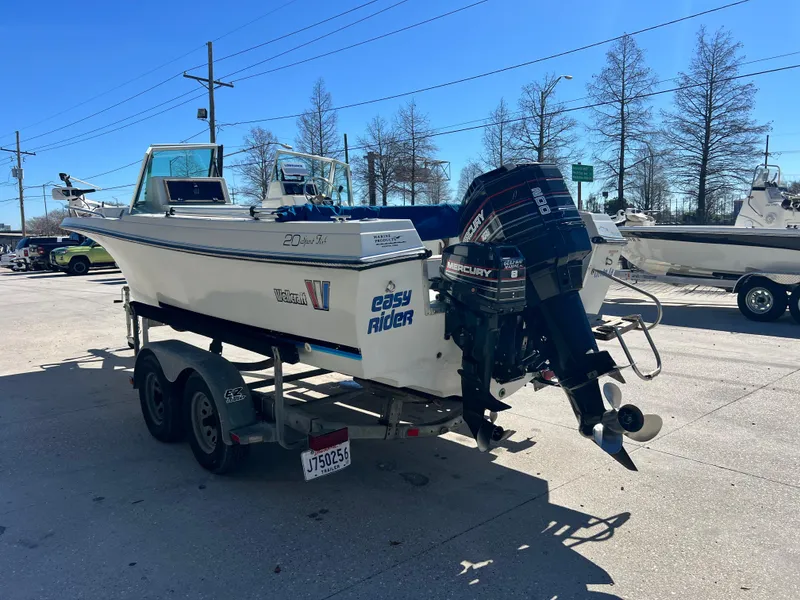 Slide: The Image of 1986 Wellcraft V-20 Sport boat on trailer with outboard motor. - 7