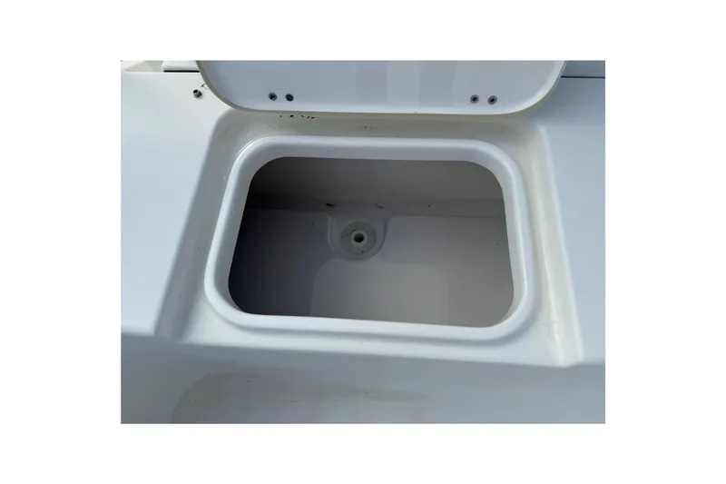 Slide: The Image of Open storage compartment on a 2014 Tidewater 230 LXF boat. - 16