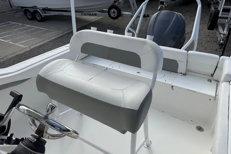 Slide: The Image of 2014 Tidewater 230 LXF boat interior with steering wheel and seating. - 18