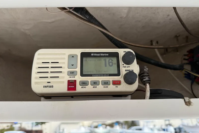 Slide: The Image of VHF marine radio on 2014 Tidewater 230 LXF boat, displaying channel 16. - 22