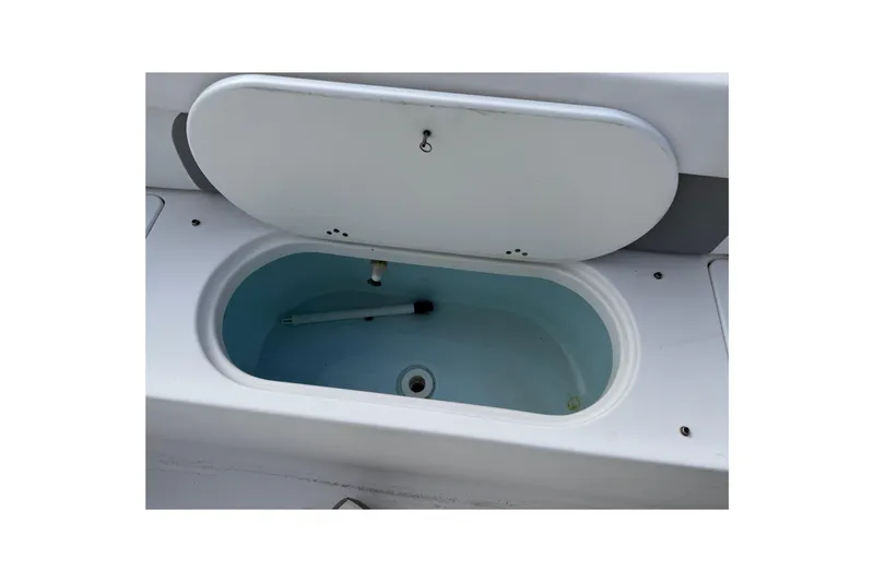 Slide: The Image of Open storage compartment on 2014 Tidewater 230 LXF boat, showcasing interior space. - 23