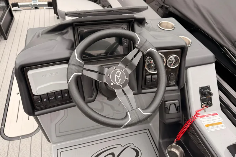 Slide: The Image of 2026 Veranda VR 235 VL boat dashboard with steering wheel and control panel. - 12