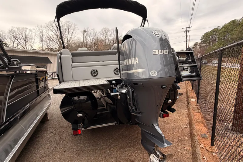 Slide: The Image of 2026 Veranda VR 235 VL pontoon boat with Yamaha 300 outboard motor, parked outdoors. - 4