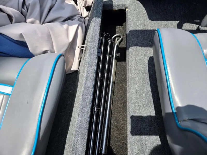 Slide: The Image of Interior of a 1994 Hydra-Sports 175 FS boat showing storage compartment and seats. - 12