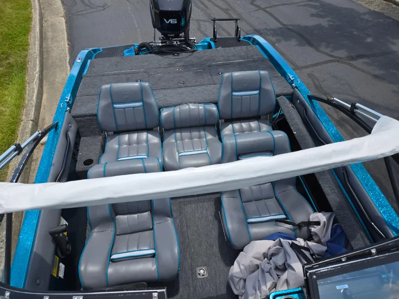 Slide: The Image of 1994 Hydra-Sports 175 FS boat interior with gray and blue seating, V6 engine visible. - 19