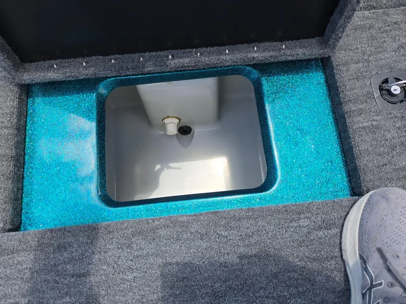 Slide: The Image of 1994 Hydra-Sports 175 FS boat compartment with blue trim and gray carpet. - 21