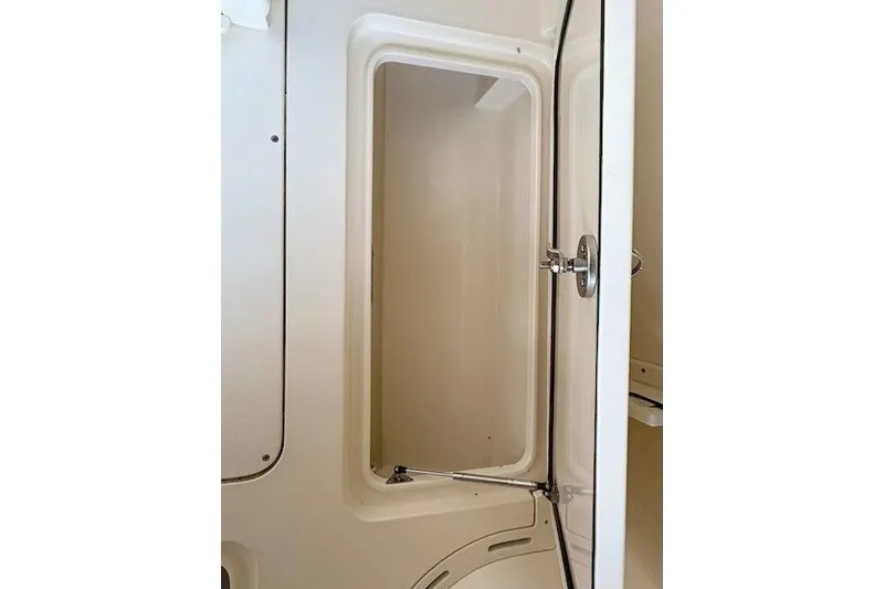 Slide: The Image of 2019 Scout 275 LXF boat interior cabin door, showcasing sleek design and functionality. - 12