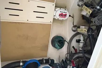 Slide: The Image of 2019 Scout 275 LXF boat interior showing mechanical components and wiring. - 13