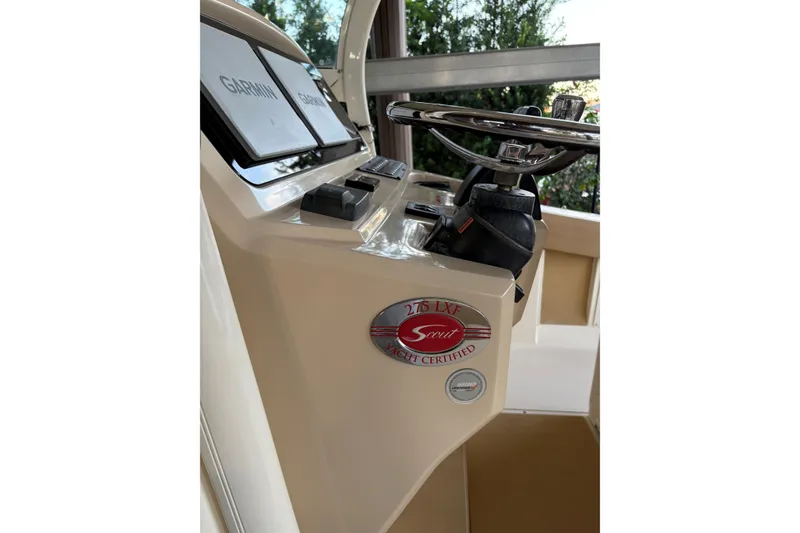 Slide: The Image of 2019 Scout 275 LXF boat dashboard with Garmin displays and steering wheel. - 5