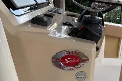 Slide: The Image of 2019 Scout 275 LXF boat dashboard with yacht certification badge. - 6