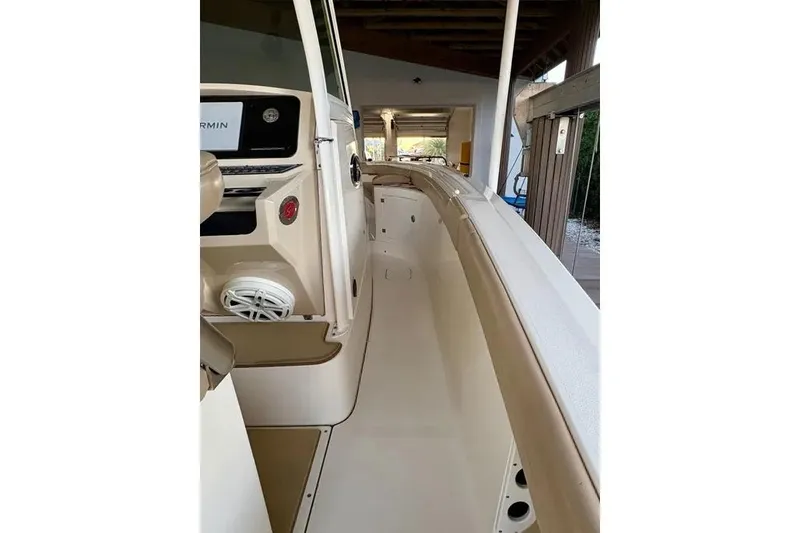 Slide: The Image of 2019 Scout 275 LXF boat interior with Garmin display and speaker system. - 7
