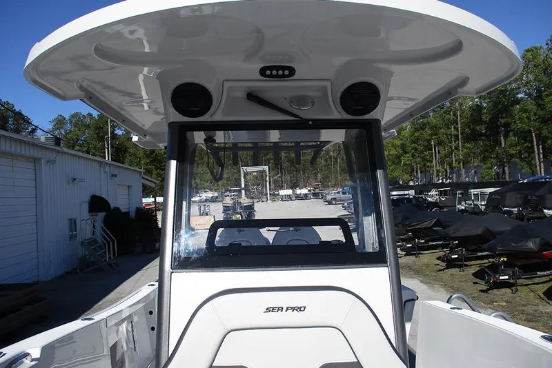 Slide: The Image of 2026 Sea Pro 262 Offshore boat interior with T-top and console view. - 11
