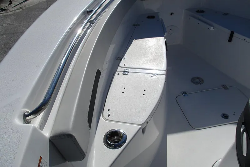 Slide: The Image of 2026 Sea Pro 262 Offshore boat interior with storage compartments and stainless steel railing. - 12
