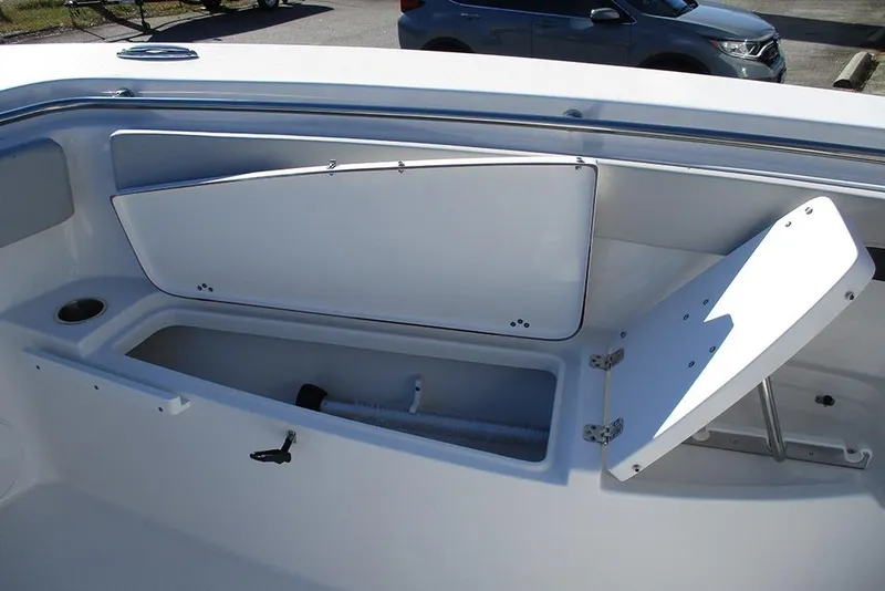 Slide: The Image of 2026 Sea Pro 262 Offshore boat storage compartments with open hatches. - 18