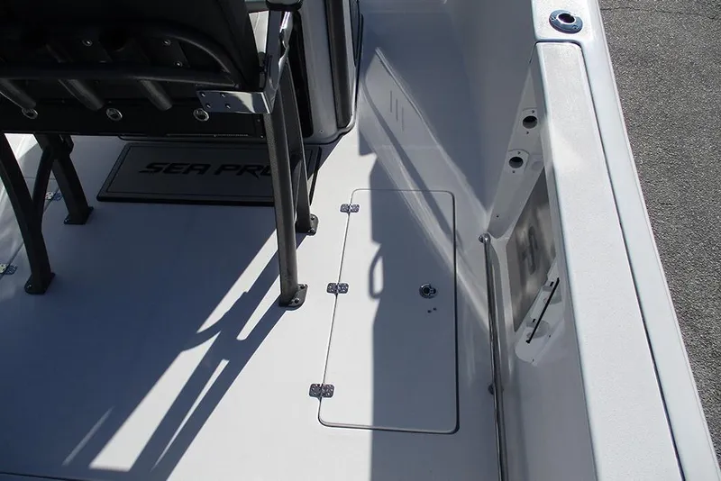 Slide: The Image of 2026 Sea Pro 262 Offshore boat deck with storage compartment and seating. - 25