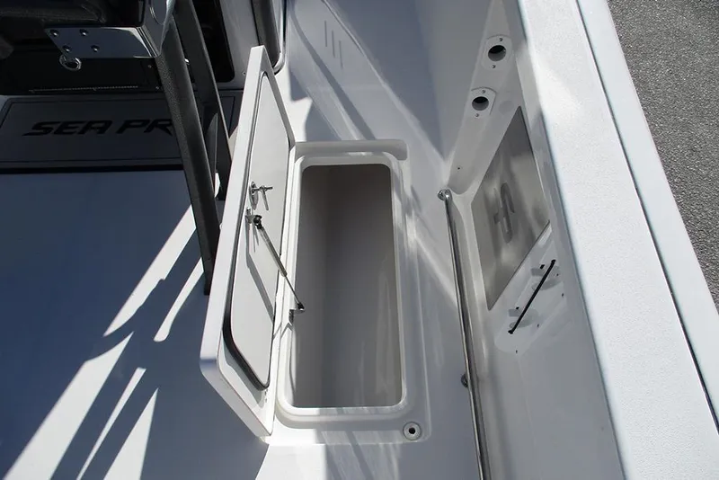 Slide: The Image of 2026 Sea Pro 262 Offshore boat storage compartment with open hatch. - 26