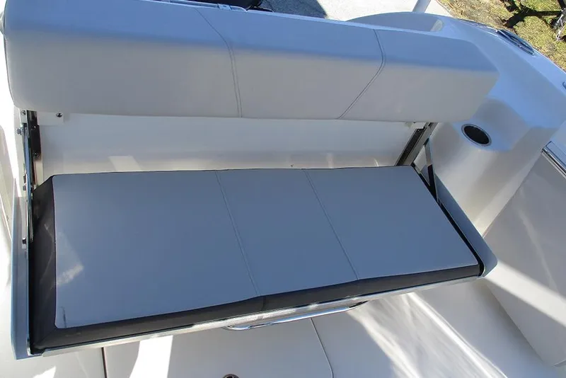 Slide: The Image of 2026 Sea Pro 262 Offshore boat seat with gray upholstery and cup holder. - 35