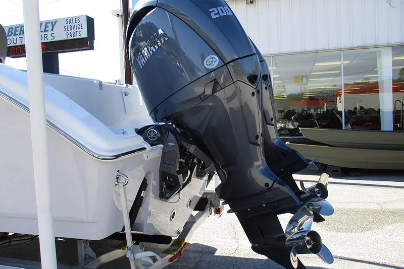 Slide: The Image of 2026 Sea Pro 262 Offshore boat with Yamaha outboard motor displayed outdoors. - 10