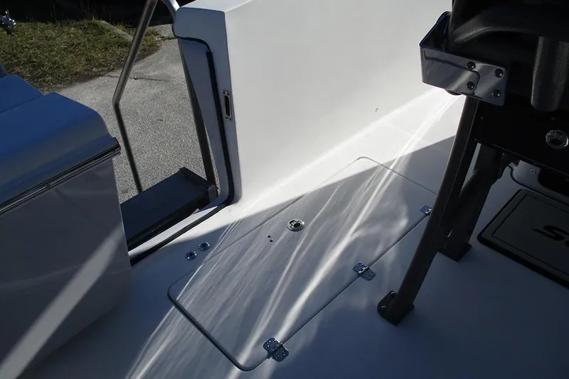 Slide: The Image of 2026 Sea Pro 262 Offshore boat deck with seating and storage compartments. - 27