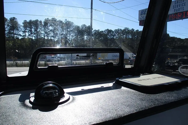 Slide: The Image of Interior view of 2026 Sea Pro 262 Offshore boat dashboard with compass. - 41