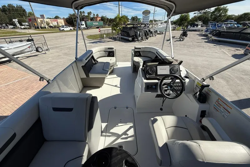 Slide: The Image of 2023 Hurricane FunDeck 2260 RE OB boat interior with seating and steering console. - 13