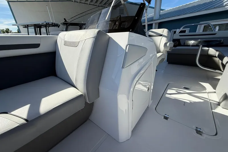 Slide: The Image of 2023 Hurricane FunDeck 2260 RE OB interior with sleek seating and modern design. - 19