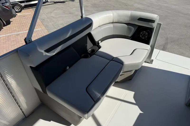 Slide: The Image of 2023 Hurricane FunDeck 2260 RE OB boat interior with gray seating and cup holders. - 21