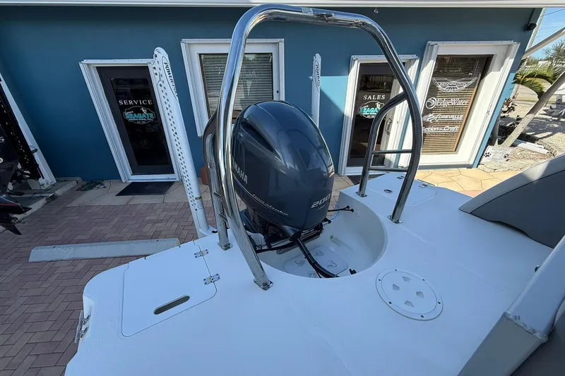 Slide: The Image of 2023 Hurricane FunDeck 2260 RE OB boat with Yamaha outboard motor, docked near service center. - 7