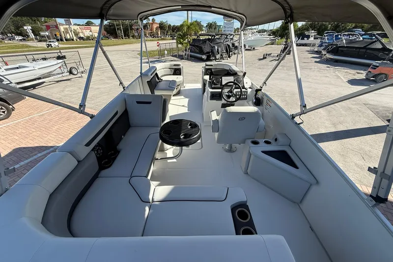 Slide: The Image of 2023 Hurricane FunDeck 2260 RE OB boat interior with seating and steering console. - 9