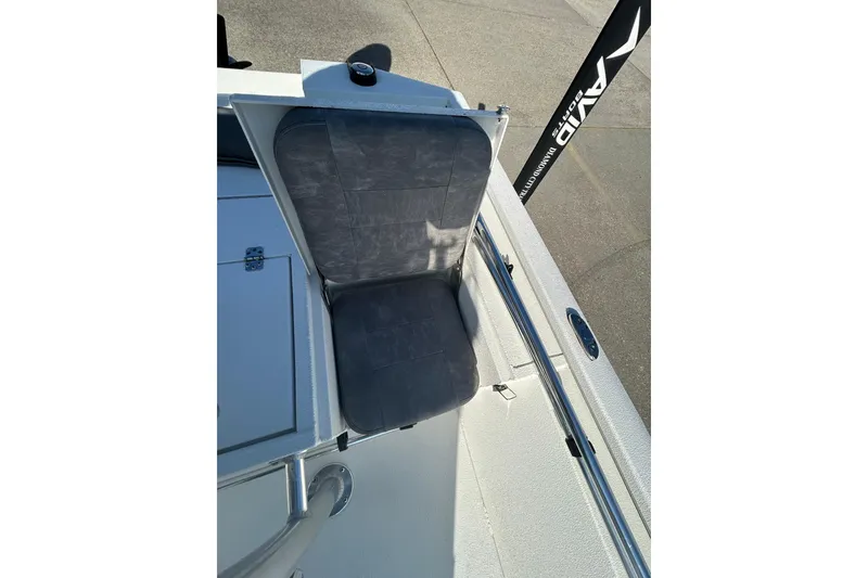 Slide: The Image of 2024 Avid 21 FS boat seat with gray cushion and storage compartment. - 10
