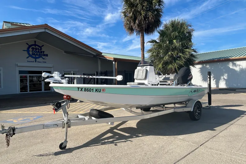 Slide: The Image of 2024 Avid 21 FS boat on trailer outside Gulf Coast Marine dealership. - 2