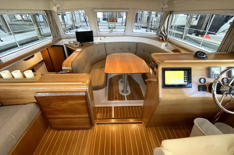 Slide: The Image of Interior of 2006 PDQ 34 Power Catamaran with wood finishes and navigation equipment. - 17