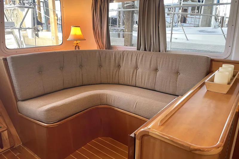 Slide: The Image of Cozy interior of 2006 PDQ 34 Power Catamaran with cushioned seating and ambient lighting. - 18