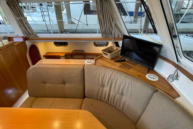Slide: The Image of Interior of 2006 PDQ 34 Power Catamaran with cozy seating and TV. - 26